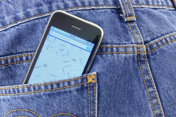 Smartphone with GPS navigator in blue jean pocket