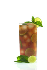 Refreshing iced tea out of black tea, ice cubes, lime