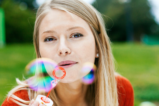 Girl making soap bubbles