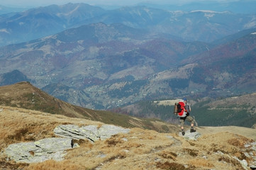 Fototapeta premium Lonely trekking man in Rodnei mountains, Romania