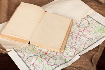 Vintage open book and map