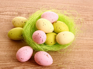 colorful easter eggs in nest