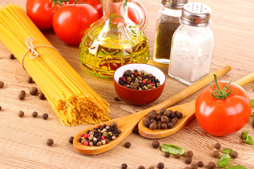 Pasta spaghetti with tomatoes, olive oil, peper  and basil on a