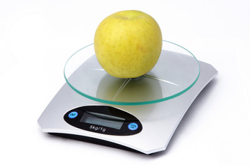 Apple on weighing machine