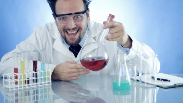 Mad Scientist laughing holding Volumetric Flask with red liquid