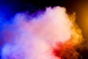 Red, Yellow and blue smoke  on black background - 31357157