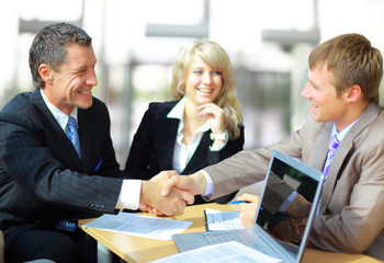Business people shaking hands, finishing up a meeting