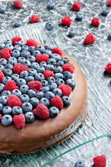 chocolate cake with raspberries and blueberries