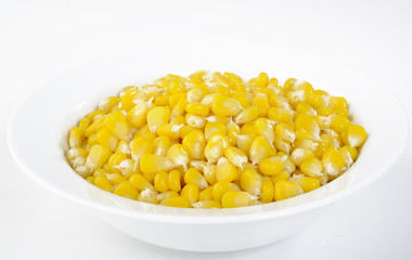 corn seeds in white bowl