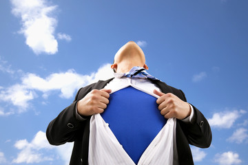 Businessman pulling  his t-shirt open
