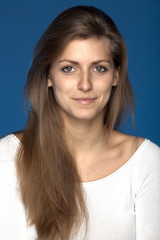 Fototapeta premium Close-up portrait of young female looking at the camera