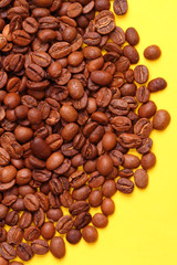 Coffee beans on a yellow background