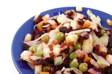 Russian vinaigrette salad in blue plate