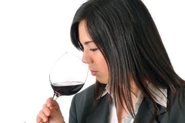 young brown woman smelling a glass of red wine - 31372994