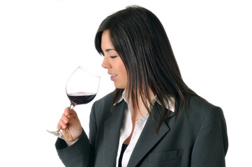 young brown woman smelling a glass of red wine - 31372996