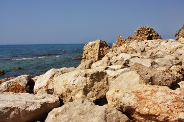 Fototapeta na wymiar Ruins of an old fortress on the beach