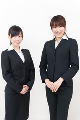 two asian businesswomen standing