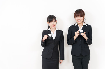 two asian businesswomen relaxing
