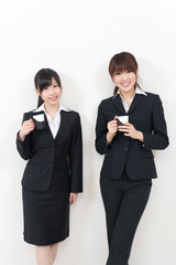 two asian businesswomen relaxing