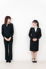 two asian businesswomen standing