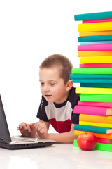 boy typing on laptop