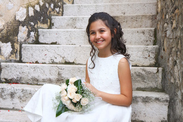 Smiling girl in white dress