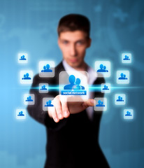 Man pressing social network icon