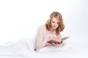 young beautiful girl reads book
