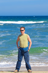 The sports man  standing  near  the sea