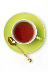 green cup of tea isolated on white