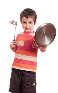 Little boy play knight with kitchen utensil