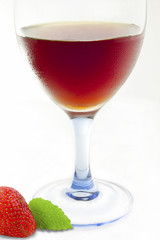 red cocktail with strawberry on white background
