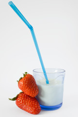 milk with straw and strawberries