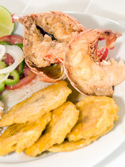 Caribbean lobster tail dinner with tostones rice salad