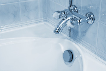 faucet and white bath