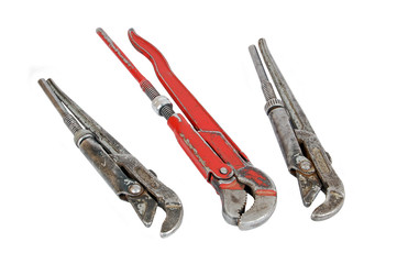 Old rusty adjustable gas wrench, isolated on white background