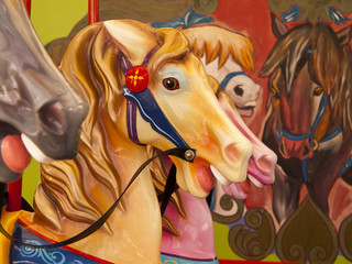 Fototapeta na wymiar Colorful Horses On Carousel