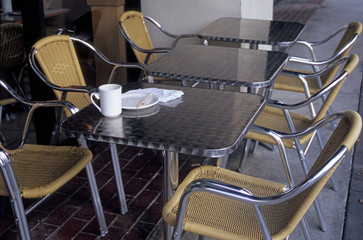 Tables, Chairs, Dishes at Outdoor Cafe