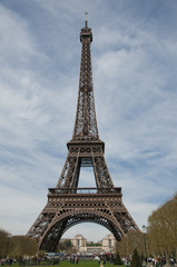 Fototapeta na wymiar Tourist attraction Eiffel Tower in a cloudy day