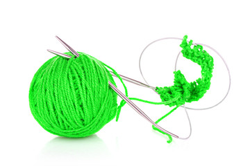 Knitting yarn and  knitting needles on white