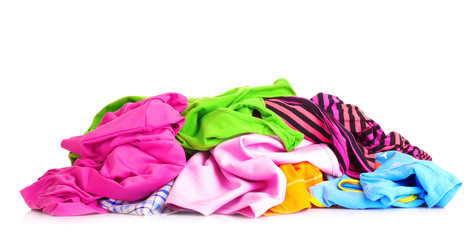 Big heap of colorful clothes   isolated on white background