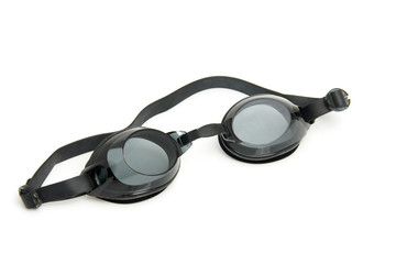 Black dive goggles over white background