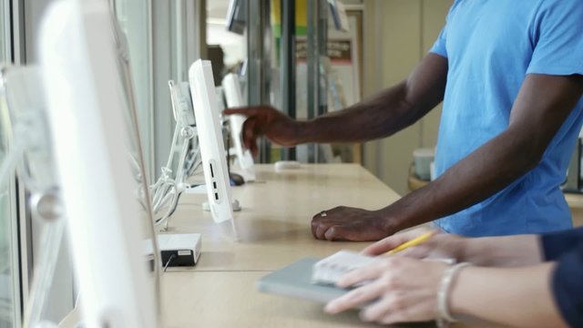 people using pc in library