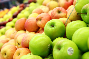 Naklejka na ściany i meble green and red apples at the farmers market
