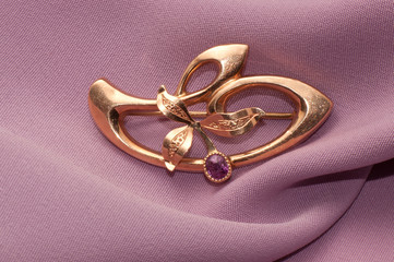 Golden brooch with amethyst © pandora2004