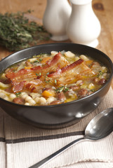 Tuscan soup with crispy bacon and beans
