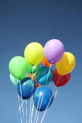 Colorful balloons in a clear blue sky