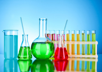 Laboratory glassware on blue background