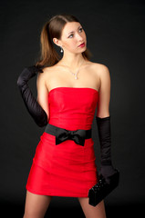 Beautiful female in red evening dress