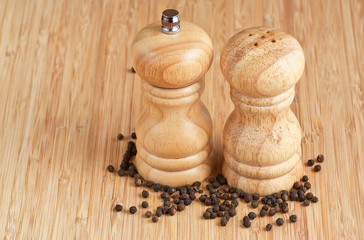 salt and pepper grinders on a table